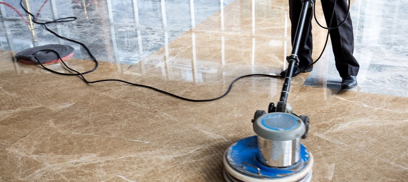 people polishes floor indoors